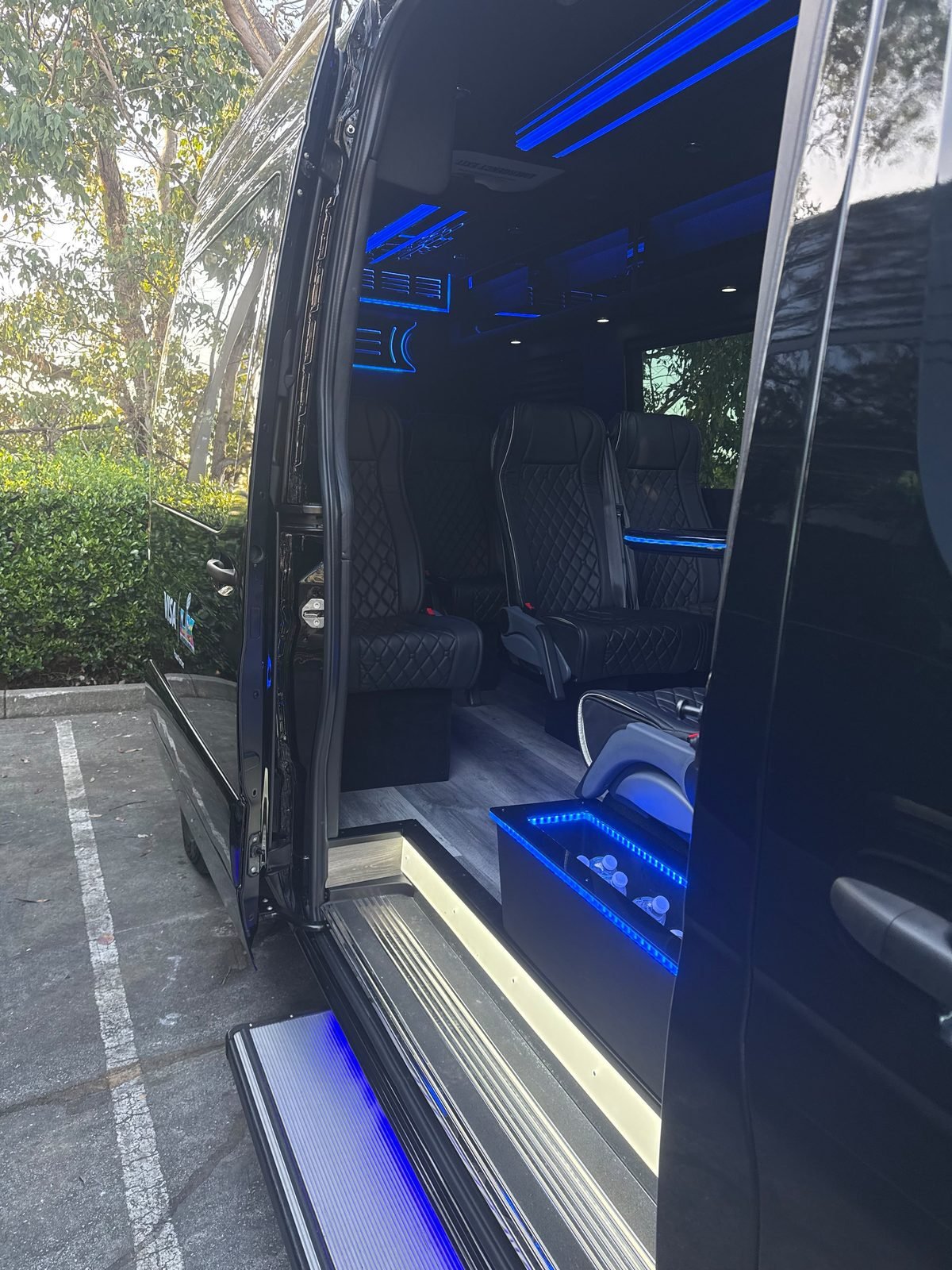 Mercedes-Benz Sprinter with the passenger entry door open and the step down